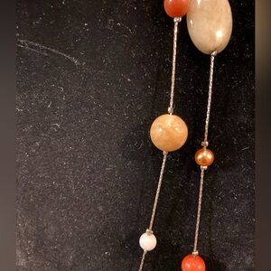 🦊 46-inch necklace - one strand of silver tone strand with multicolored beads.